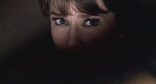A frightened Audrey, hiding from Walther Matthau