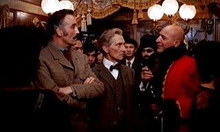 Christopher Lee and Peter Cushing do not impress Cossack Capt. Telly Savalas.